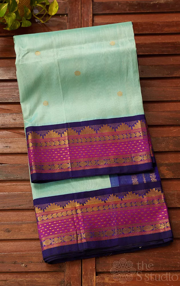 Light blue kanchipuram silk cotton saree with navy blue korvai border