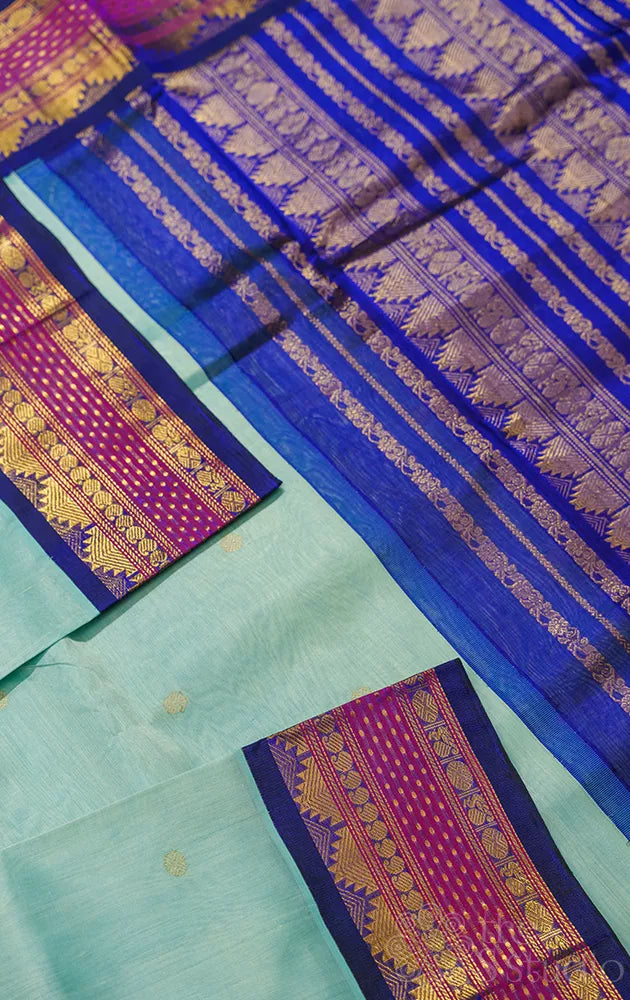 Light blue kanchipuram silk cotton saree with navy blue korvai border