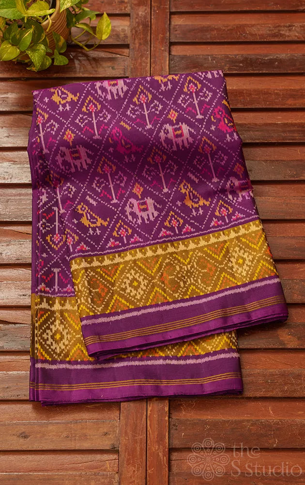 Purple rajkot patola saree with all over ikat design and tissue border