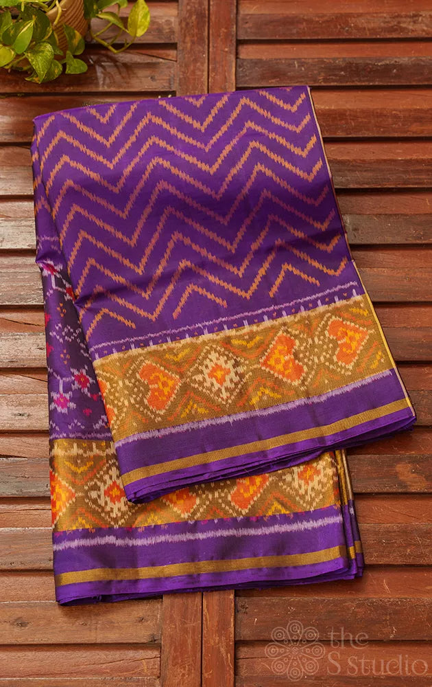 Violet patola pattu saree with all over ikat design and tissue border