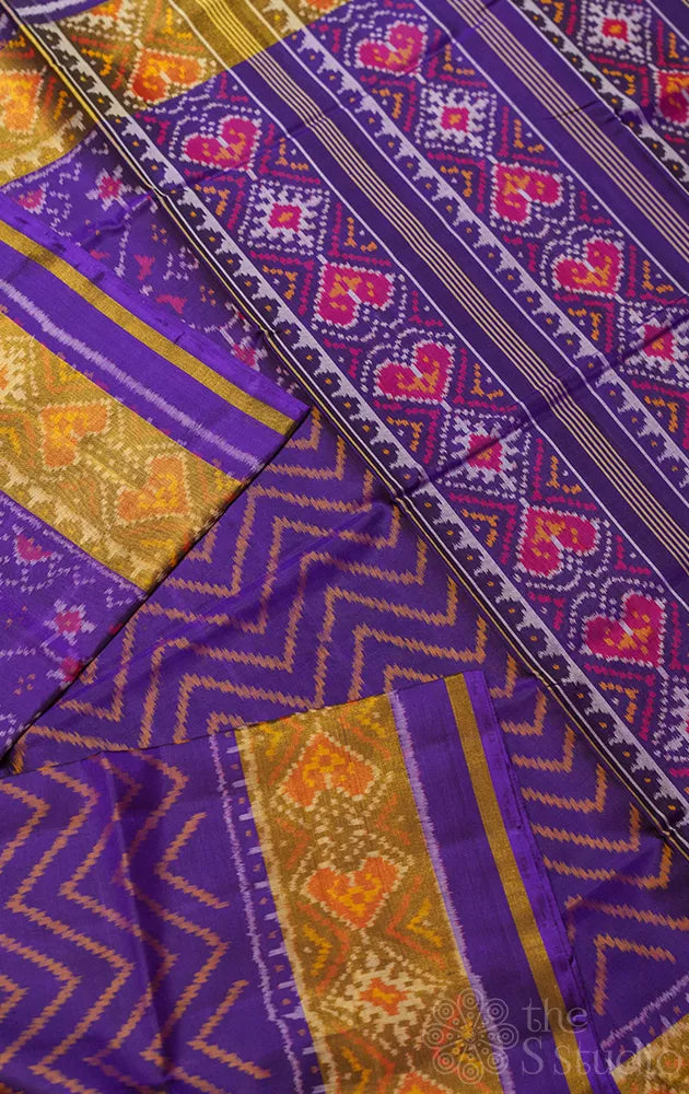 Violet patola pattu saree with all over ikat design and tissue border