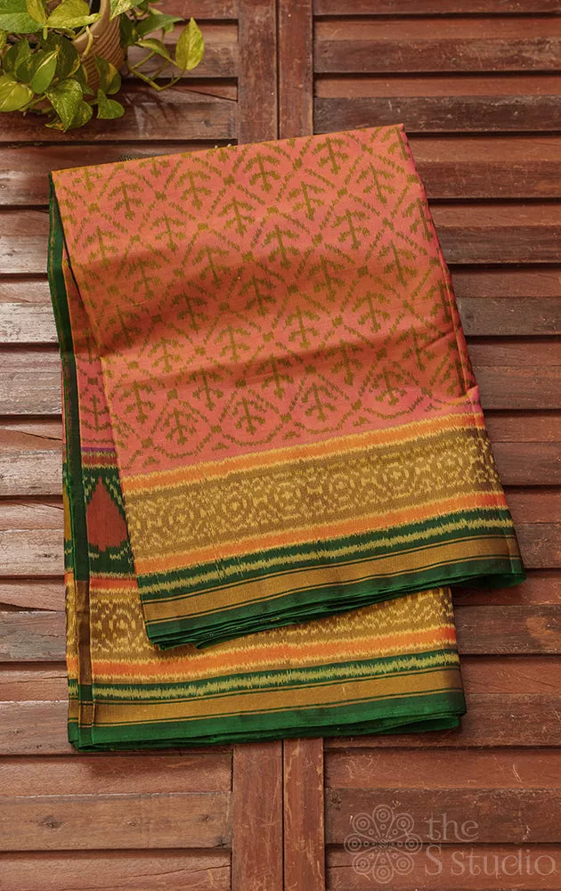 Peach patola saree with green border and all over design