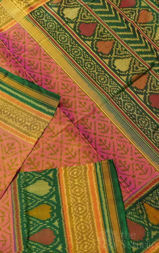 Peach patola saree with green border and all over design