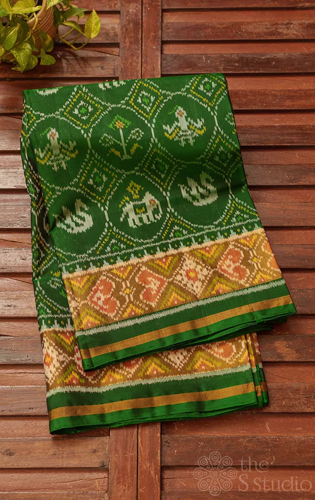 Green rajkot patola saree with all over ikkat design and tissue border