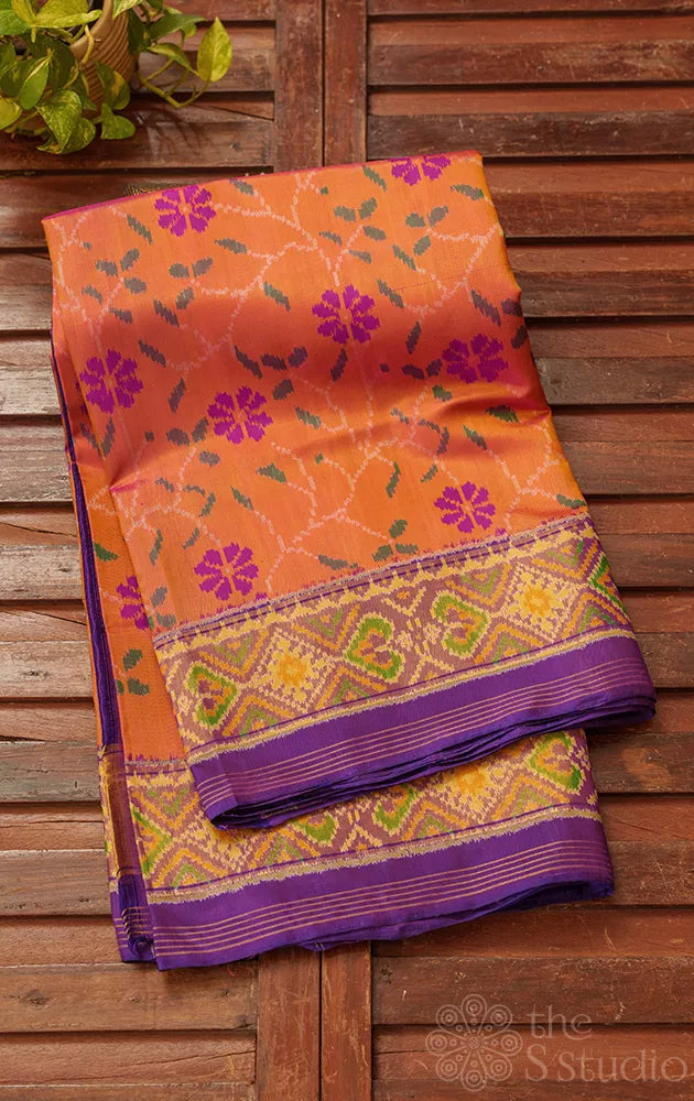 Peach patola pattu saree with woven floral motifs and tissue border
