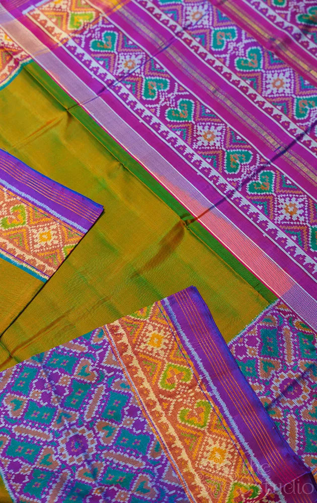 Dual tone green rajkot patola saree with purple border in ikat design