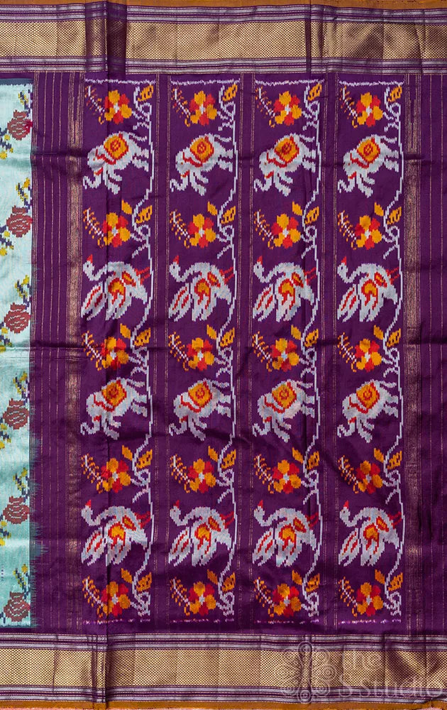 Pale green ikkat silk saree with contrast purple zari border