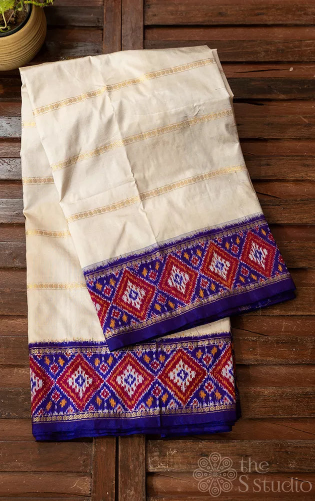 Off white ikkat silk saree with geometric violet border