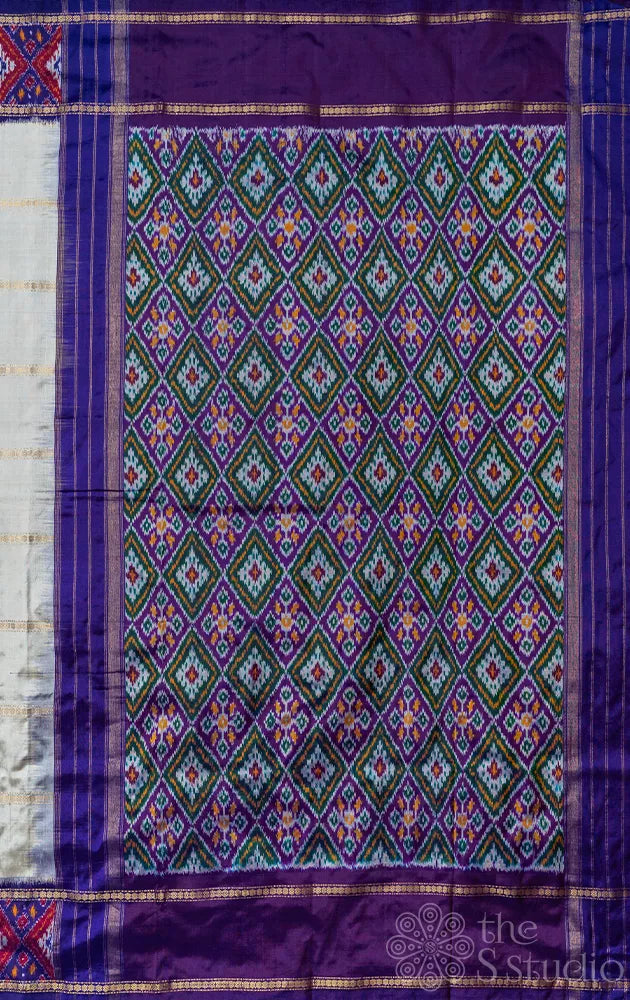 Off white ikkat silk saree with geometric violet border