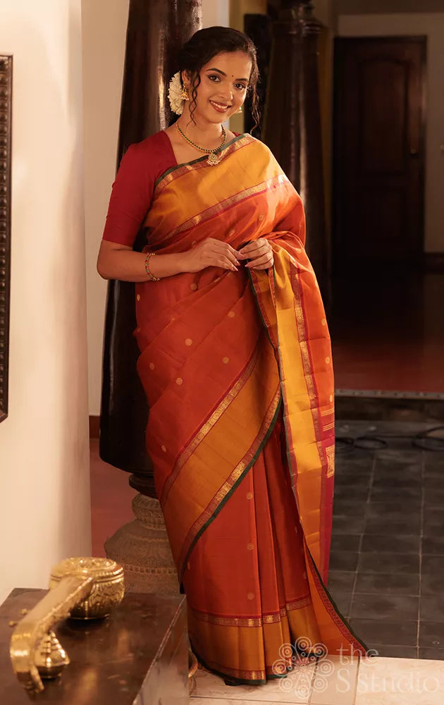 Rust kanchipuram silk saree with rettaipet border