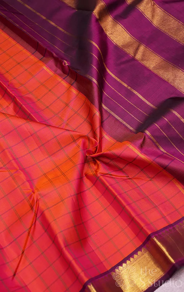 Peachish orange checked kanjivaram silk saree with purple zari border