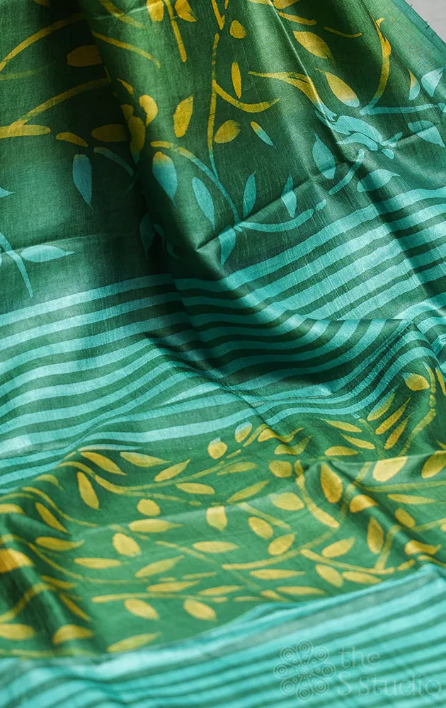 Green handwoven tussar silk saree with batik prints