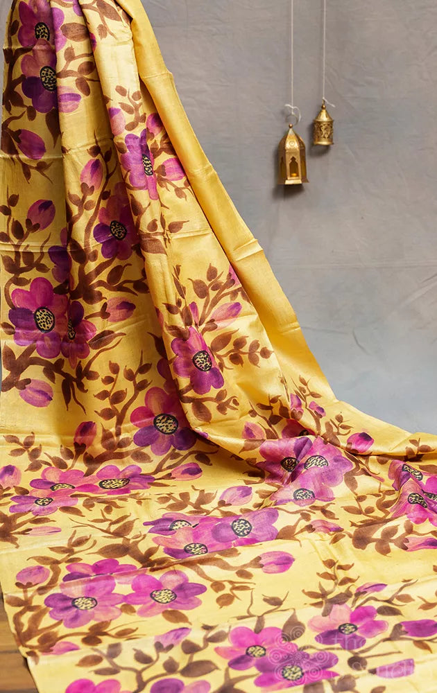 Light yellow tussar silk saree with floral batik prints and hand painting