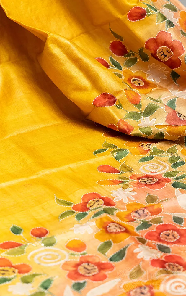 Yellow tussar silk saree with floral hand painting and hand embroidery