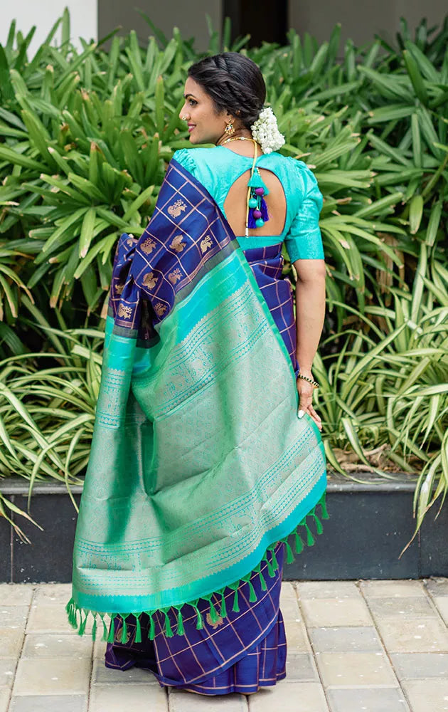 Aubergine colour kanchi pattu saree with checks and buttas