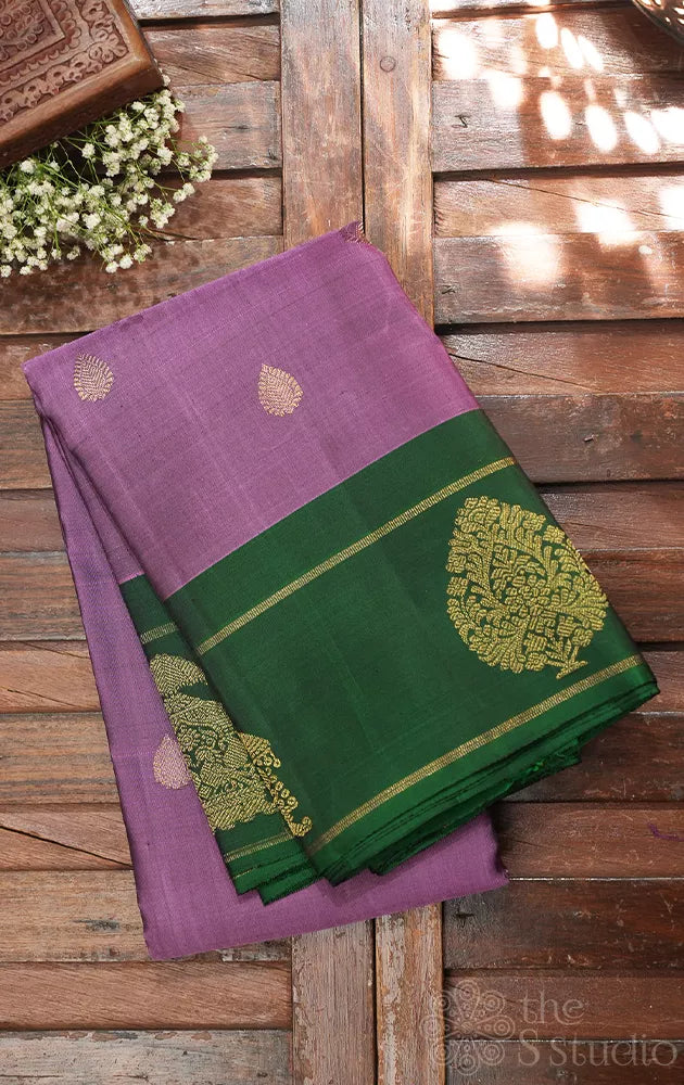 Lavendar kanjeevaram silk saree with green butta woven border