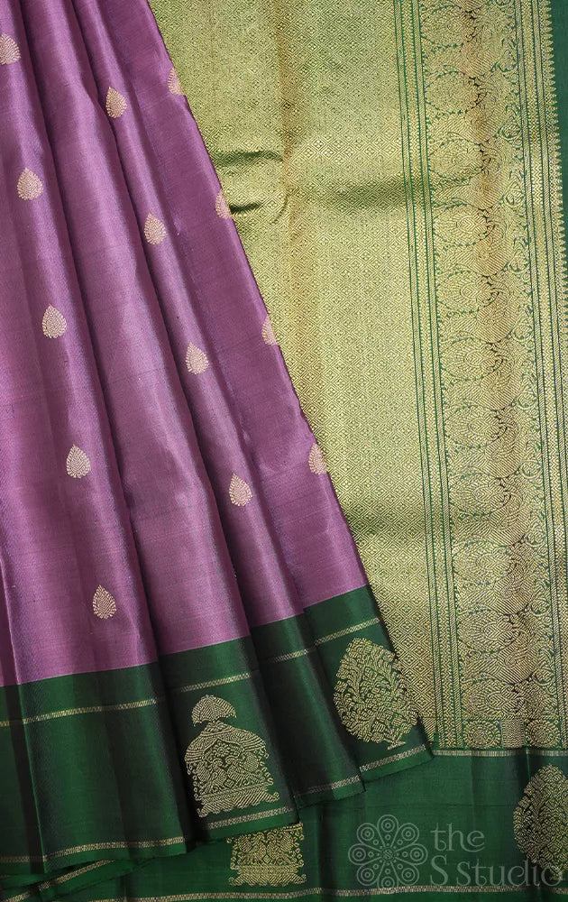 Lavendar kanjeevaram silk saree with green butta woven border