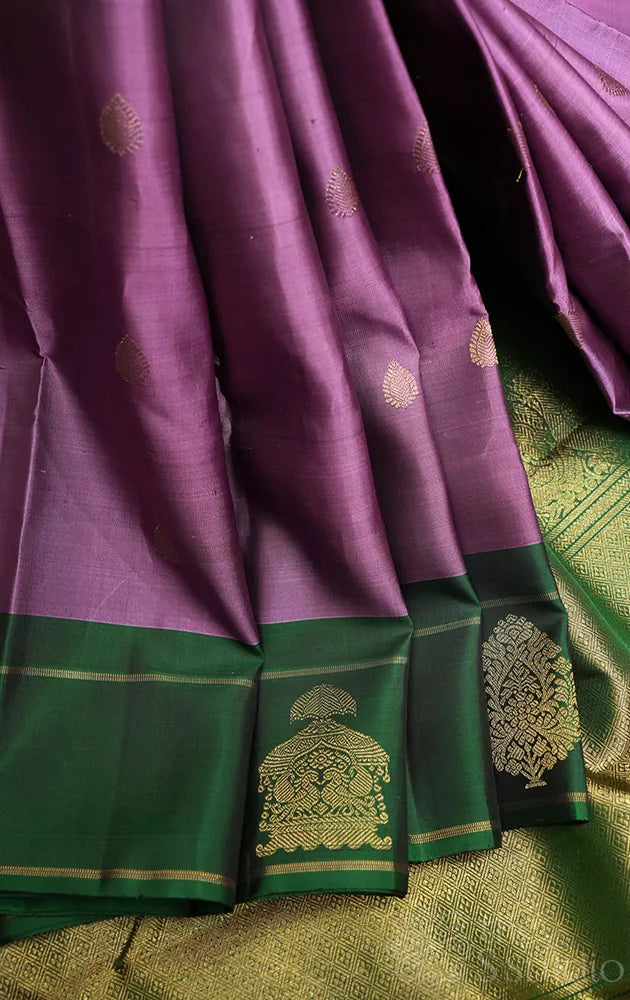 Lavendar kanjeevaram silk saree with green butta woven border