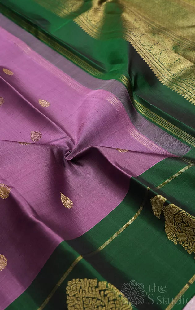 Lavendar kanjeevaram silk saree with green butta woven border