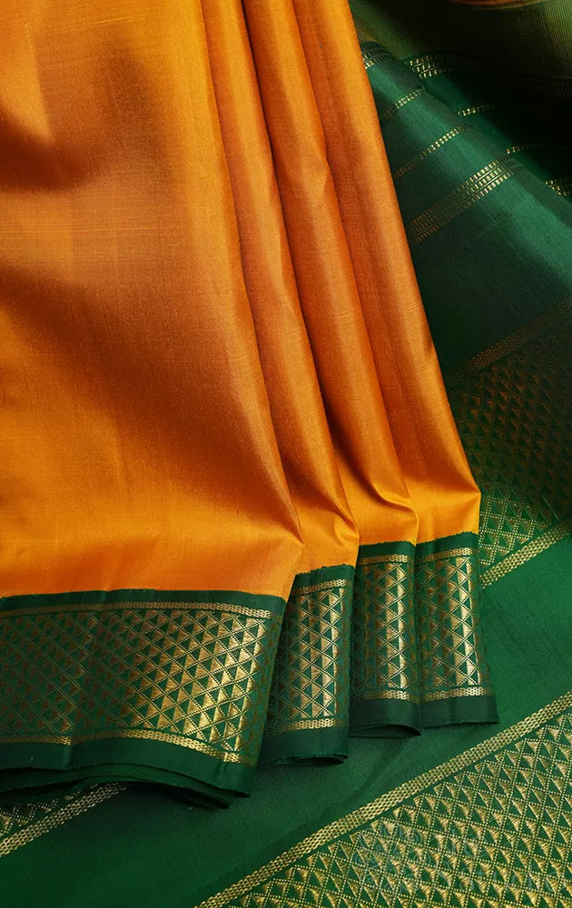 Mustard madisar kanchipuram silk saree with korvai green border