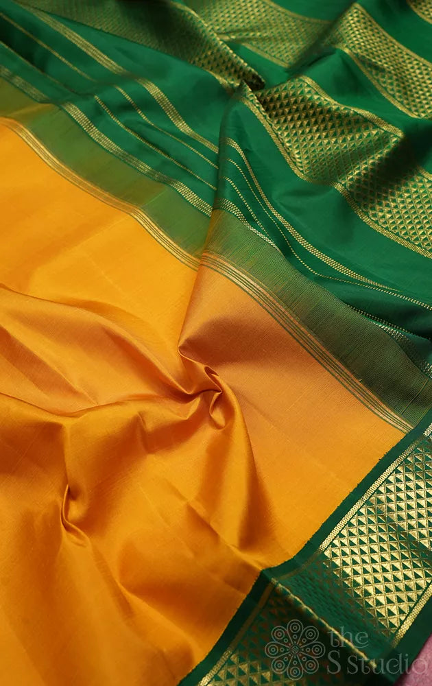 Mustard madisar kanchipuram silk saree with korvai green border