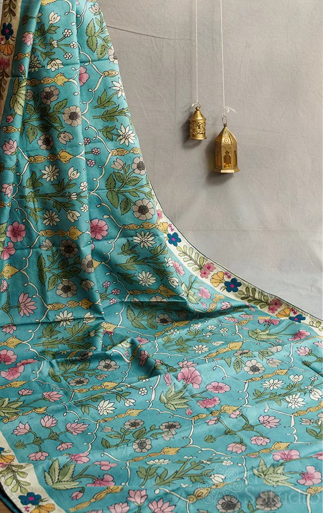 Blue tussar kalamkari saree with off white hand embroidery border