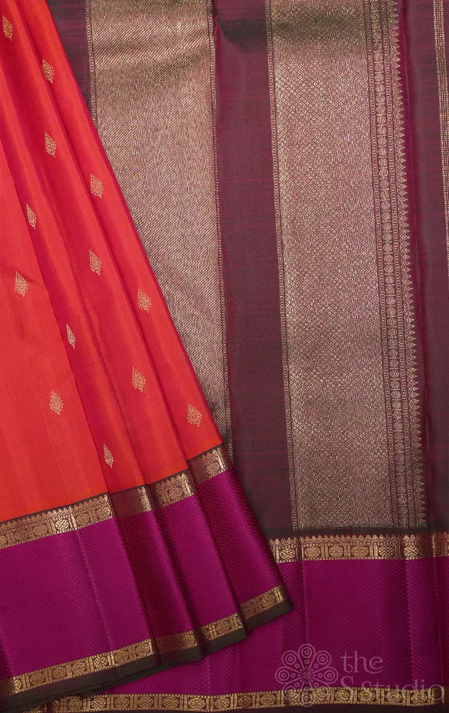 Bright orange kanchipuram silk saree with manthulir green border