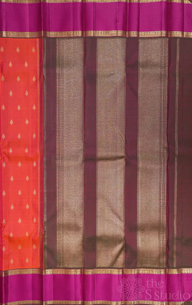 Bright orange kanchipuram silk saree with manthulir green border
