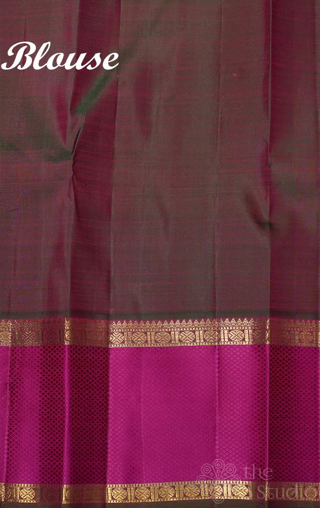 Bright orange kanchipuram silk saree with manthulir green border