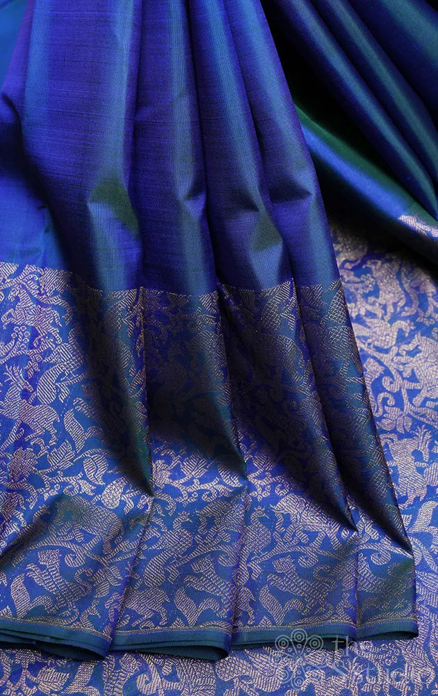 Peacock blue kanjivaram silk saree with vanasingharam border and pallu