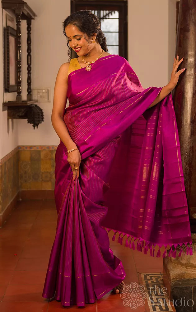 Purple kanjivaram silk saree with thread lines and simple zari border