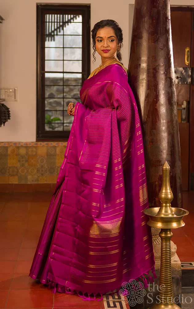 Purple kanjivaram silk saree with thread lines and simple zari border