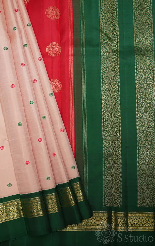 Light peach korvai kanjivaram silk saree with red and green korvai border