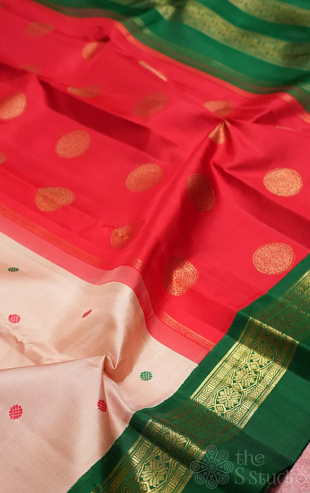 Light peach korvai kanjivaram silk saree with red and green korvai border