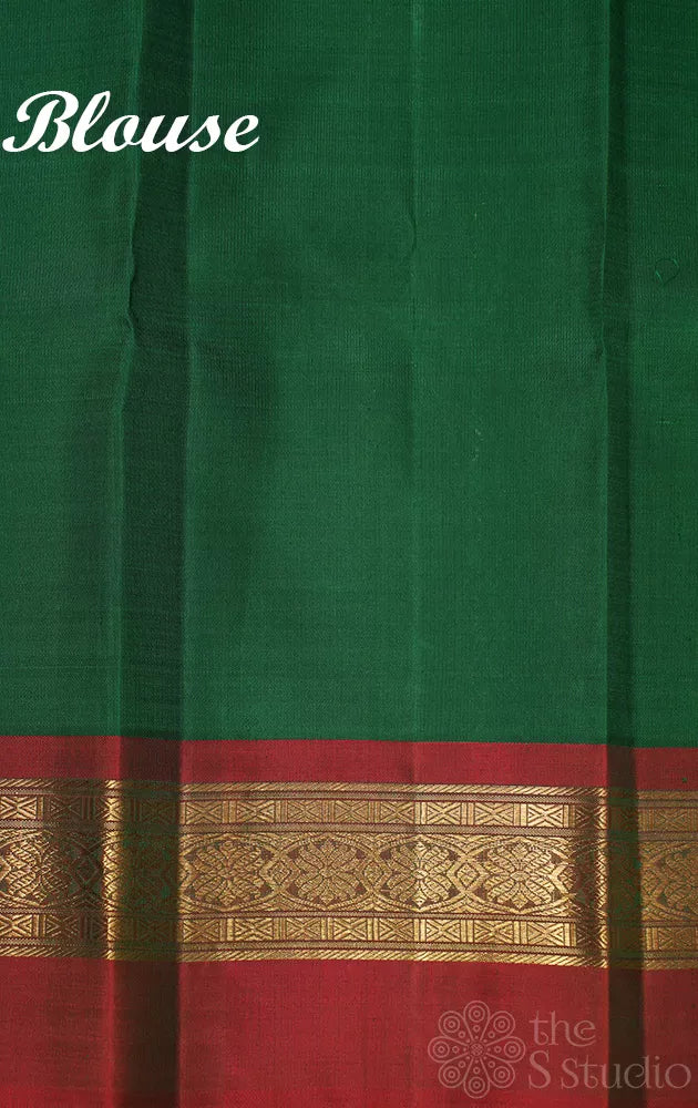 Light peach korvai kanjivaram silk saree with red and green korvai border