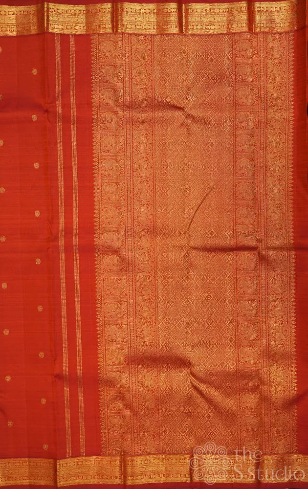 Rust kanchi silk saree with kamalam buttas and zari woven border