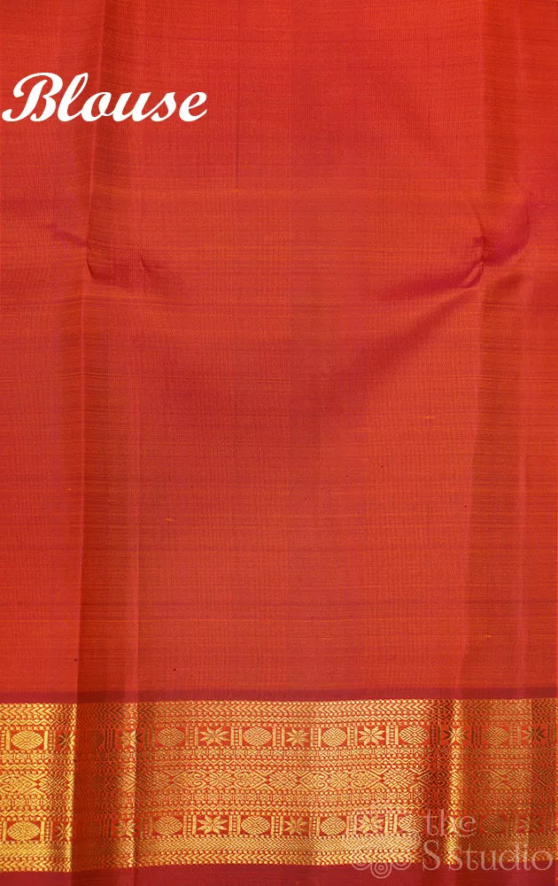 Rust kanchi silk saree with kamalam buttas and zari woven border