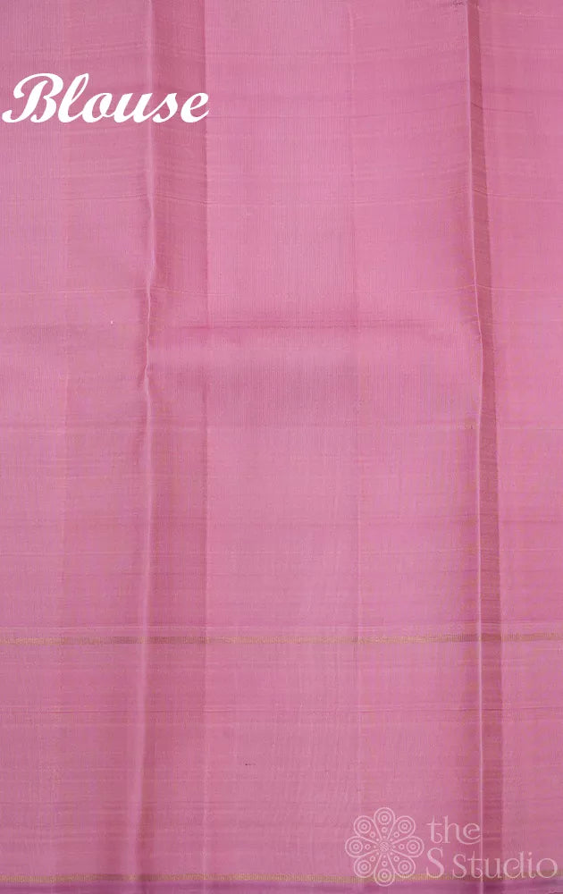 Light peach kanchi silk saree with zari bhuttas and pink border