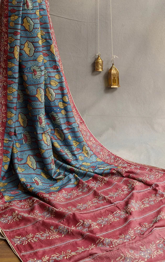 Blue tussar kalamkari saree with maroon hand embroidered pallu