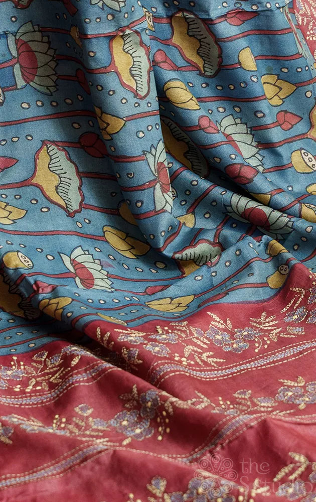 Blue tussar kalamkari saree with maroon hand embroidered pallu