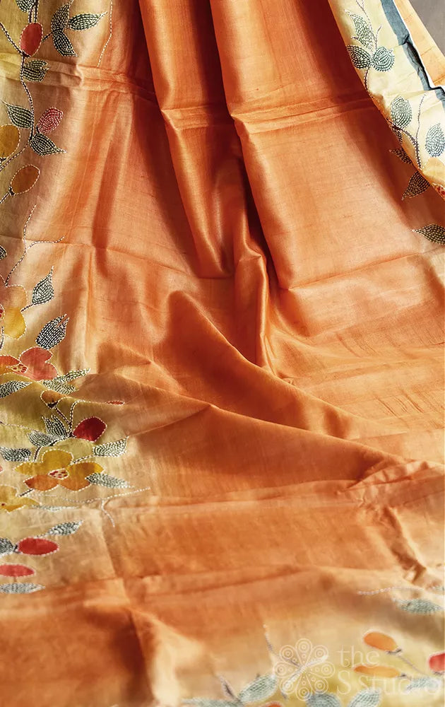 Shades of peach and light yellow tussar silk saree with batik print