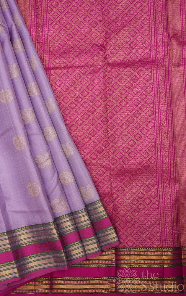 Lavender kanjivaram silk saree with rani pink rettaipet border
