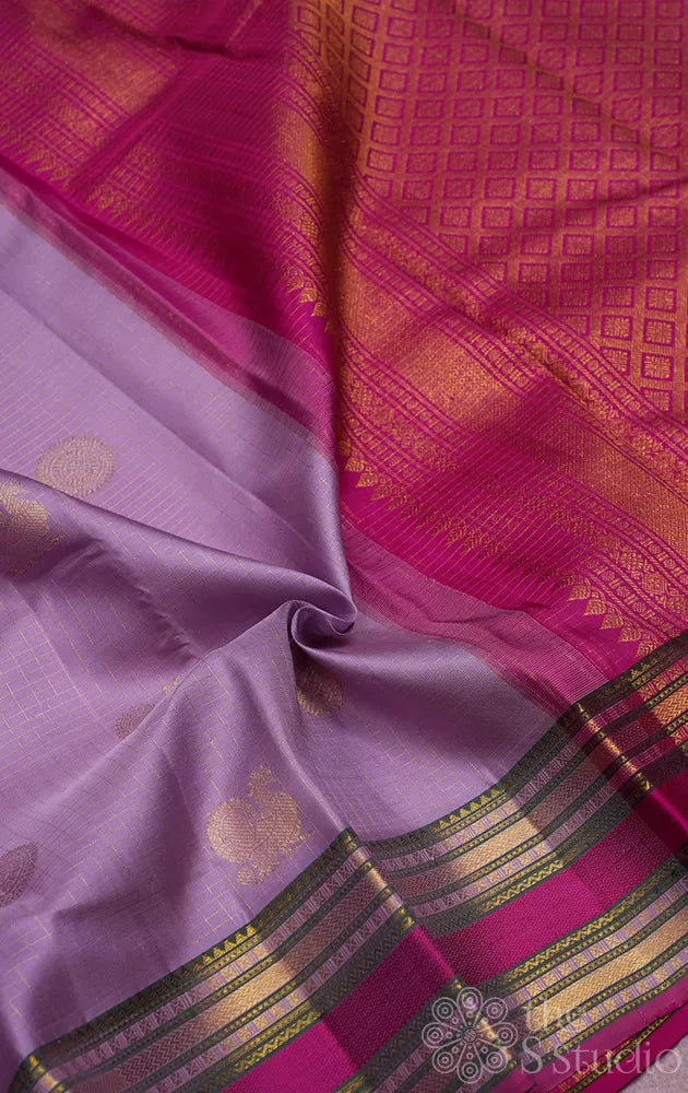 Lavender kanjivaram silk saree with rani pink rettaipet border