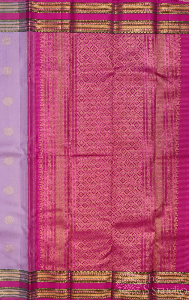 Lavender kanjivaram silk saree with rani pink rettaipet border