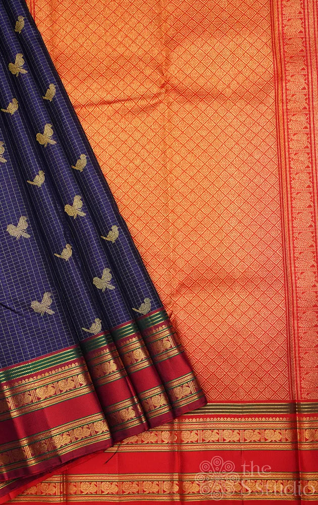 Navy blue checked kanjivaram silk saree with red rettaipet border