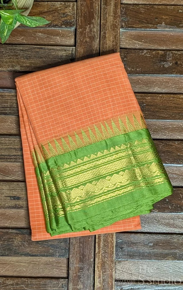 Orange checked gadwal cotton saree with green temple border
