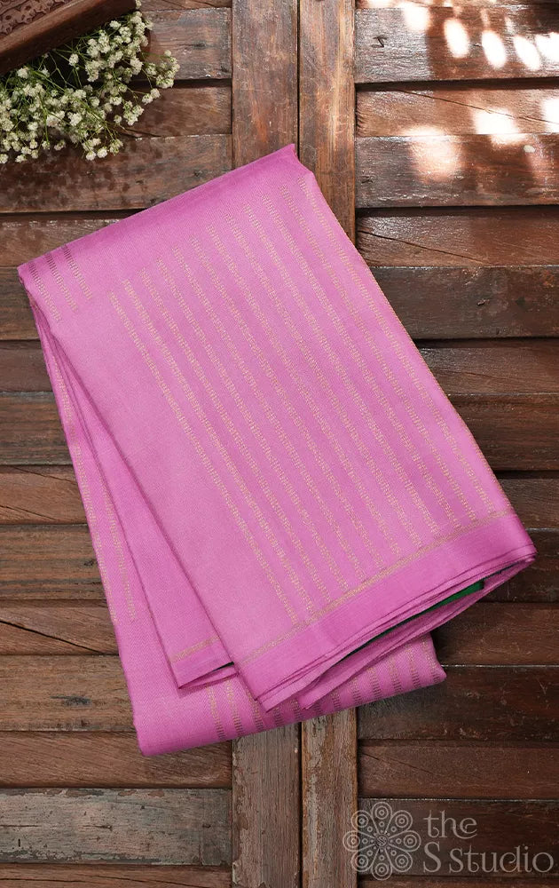Light pink zari lines kanchipuram silk saree with green pallu