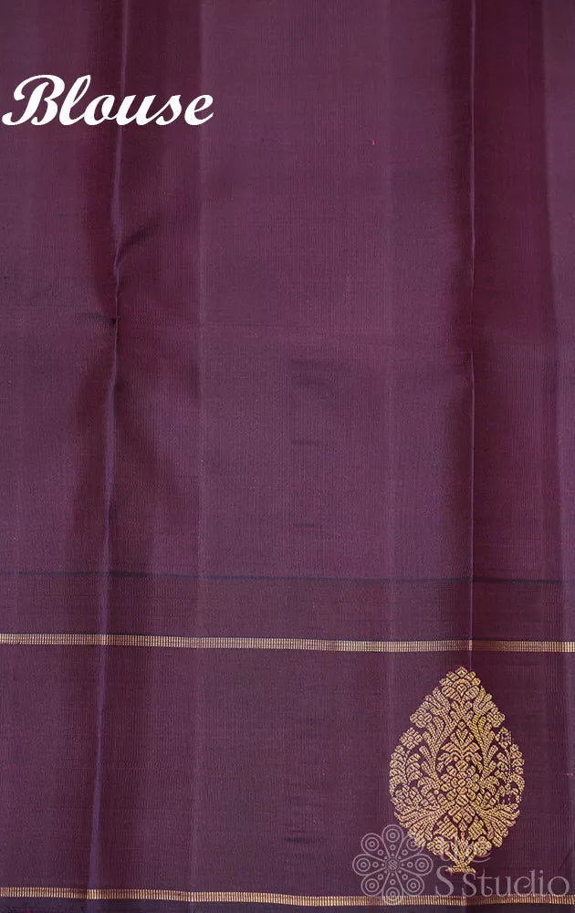 Golden green kanchi pattu saree with deep purple border