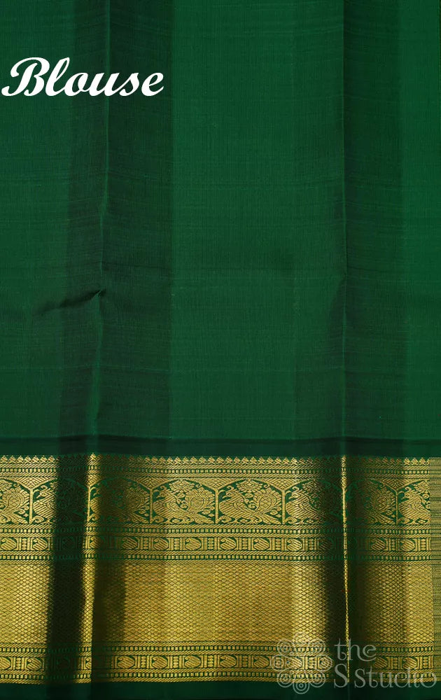 Rust orange kanchi pattu saree with korvai green zari border