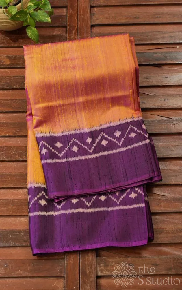 Light peach patola raw silk saree with purple border